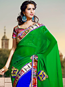 Ultimate collection of embroidery sarees with fabulous style. This green and royal blue georgette saree have beautiful embroidery patch work which is embellished with resham, beads and lace work. Fabulous designed embroidery gives you an ethnic look and increasing your beauty. Matching blouse is available. Slight Color variations are possible due to differing screen and photograph resolutions.