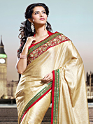 Ultimate collection of embroidery sarees with fabulous style. This beige shimmer georgette saree have beautiful embroidery patch work which is embellished with zari and sequins work. Fabulous designed embroidery gives you an ethnic look and increasing your beauty. Contrasting red blouse is available. Slight Color variations are possible due to differing screen and photograph resolutions.