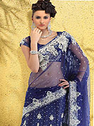 The traditional patterns used on this saree maintain the ethnic look. Royal blue lehanga style saree make you trendy look. This Drape has a beautiful and heavy handwork of stone, zari and Cerovski. This Net saree have an awesome color combination and matching designer blouse. Slight color variations possible due to differing screen and photograph resolution.  