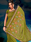 Embroidered sarees are highly in order on a range of occasions such as wedding, formal party and festivals. Because of their stunning looks, it has become popular with women all over the country.  This saree made with silk with georgette mix fabric. This saree have beautiful embroidery work on pallu and border. This saree is nicely designed with resham, zari and sitara work to give you pretty and singular look. The border of this saree is a symbol of elegance in its own. Matching blouse is available. Slight Color variations are possible due to differing screen and photograph resolutions.