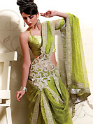 Try out this year top trends, glowing, bold and natural collection. This beautiful saree is nicely designed with rich embroidery work border in floral motifs. Embroidery is done with zari, stone, reshams and sequins work. A beautiful cutwork embroidered patch on pallu create a stunning touch. This drape is made with shimmer net fabric. Color combination of this saree is captivating and makes an impression to all. Matching blouse is available. Slight Color variations are possible due to differing screen and photograph resolutions.