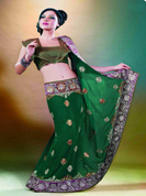 Pure premium saree with short net pallu decorated with patched buttas and lower part complemented with jacquard and net.