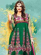 Breathtaking collection of designer suits with stylish embroidery work and fabulous style. This green net suit has beautiful embroidered work on kameez and lace border with nice mixing of huge floral patch and color gives a stylish look. Stylish neck is eye catching to impress all. Matching embroidered dupatta and churidar give you a classic look. Slight Color variations are possible due to differing screen and photograph resolutions.
