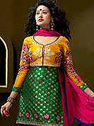 Take the fashion industry by storm in this lovely green, blue suit. This suit having a beautiful embroidered coati creates a stunning touch and adds to the elegance of the entire suit.  Brocade kameez with patch work. Matching dupatta and embroidered salwaar gives a perfect finish to the entire suit. Slight Color variations are possible due to differing screen and photograph resolutions.