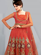 Era with extension in fashion, style, Grace and elegance have developed grand love affair with this ethnical wear. This Gorgeous red suit has long kameez which is designed with beautiful zari embroidered velvet patch work in floral patterns. This drape material is net. Matching churidar and embroidered dupatta is available. Slight color variations are possible due to differing screen and photograph resolutions.