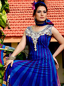 An occasion wear perfect is ready to rock you. An wonderful long kameez has designed with patch work done with resham, zari, sequins and stone work on neckline with border. Embroidered bottom area gives a stunning look. Matching churidar and embroidered dupatta is available with this suit. This drape material is net. Slight color variations are possible due to differing screen and photograph resolutions.