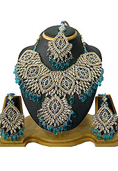 Traditional and ethnic necklace is perfect for occasion like weddings. This beautiful sky blue wedding and bridal purpose necklace awesomely crafted with white and blue diamonds with hanging crystal moti. A pair of matching earrings and beautiful maangtika embraces with this necklace. Keep away from water, sweat and perfume. Slight Color variations are possible due to differing screen and photograph resolution.