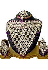 Each design has been carefully crafted keeping in mind the taste of today’s Indian woman. A drops and eye shape pattern on whole necklace studded with white and purple diamonds with hanging purple crystal moti in parallel. A pair of matching earrings and maangtika include with this necklace. Keep away from water, sweat and perfume. Slight Color variations are possible due to differing screen and photograph resolution.