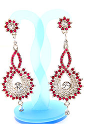 Match your outfits with this earring designed in a floral shape, so that your glamour goes beyond any comparison on your special day. A Pair of earring s nicely crafted with Pink and white diamonds. The base frame of earring is made with alloy metal. Keep away from water, sweat and perfume. Slight Color variations are possible due to differing screen and photograph resolution.