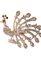 Classic and elegant brooch creations offered are a mix of traditional and ultramodern designs. This beautiful peacock patterned pink saree pin is stuuded with diamonds on alloy metal frame. Red, Blue and Maroon diamonds create centre of attraction. Keep away from water, sweat and perfume. Slight Color variations are possible due to differing screen and photograph resolution.