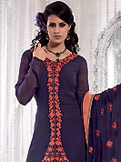 Envelope yourself in classic look with this charming suit. This navy blue and light orange A-Line kameez has beautiful embroidered patch work done with resham and dupion work in form of floral motifs. Embroidery on kameez and dupatta is highlighting the beauty of this suit. Color combination of this suit is captivating and makes an impression to all. Santoon churidar and georgette dupatta come along with this suit. This beautiful party wear made with georgette fabric. Slight Color variations are possible due to differing screen and photograph resolutions.