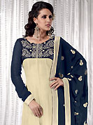 You can be sure that ethnic fashions selections of clothing are taken from the latest trend in today’s fashion. This cream and navy blue anarkali kameez has beautiful embroidered patch work on neckline and border done with resham, zari and dupion work in form of floral motifs. Embroidery on kameez and dupatta is highlighting the beauty of this suit. Color combination of this suit is captivating and makes an impression to all. Santoon churidar and georgette dupatta come along with this suit. This beautiful party wear made with georgette fabric. Slight Color variations are possible due to differing screen and photograph resolutions.