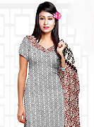 The popularity of this dress comes from the fact that it showcases the beauty modesty as well as exquisitely. This Suit has beautiful printed kameez which is crafted with floral and geometrical pattern. This casual wear drape made with cotton fabric. Contrasting maroon churidar and dupatta is available. The entire ensemble makes an excellent wear. Slight Color variations are possible due to differing screen and photograph resolutions.