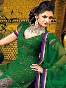 The color range from natural shades looks ravishing. The dazzling deep green A-Line kameez have amazing embroidery and patch work. Embroidery is done with resham, zari and stone work. Beautiful embroidery work on kameez is stunning. The entire ensemble makes an excellent wear. Matching churidar and dupatta is available with this suit. This beautiful wedding wear suit is made with viscose fabric. Slight Color variations are possible due to differing screen and photograph resolutions.