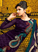 Emblem of fashion and beauty, each piece of our range of embroidered suit is certain to enhance your look as per today’s trends. The dazzling deep purple A-Line kameez have amazing embroidery and patch work. Embroidery is done with resham, beads and brasso work. Beautiful embroidery work on kameez is stunning. The entire ensemble makes an excellent wear. Matching churidar and dupatta is available with this suit. This beautiful wedding wear suit is made with faux georgette fabric. Slight Color variations are possible due to differing screen and photograph resolutions.