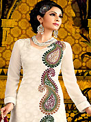 Emblem of fashion and beauty, each piece of our range of embroidered suit is certain to enhance your look as per today’s trends. The dazzling white A-Line kameez have amazing embroidery and patch work. Embroidery is done with resham, beads and brasso work. Beautiful embroidery work on kameez is stunning. The entire ensemble makes an excellent wear. Matching churidar and dupatta is available with this suit. This beautiful wedding wear suit is made with faux georgette fabric. Slight Color variations are possible due to differing screen and photograph resolutions.