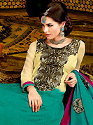 The traditional patterns used on this suit maintain the ethnic look. The dazzling cream and green kameez have amazing embroidery and patch work. Embroidery is done with resham, zari, and cut work. Beautiful embroidery work on kameez is stunning. The entire ensemble makes an excellent wear. Matching churidar and dupatta is available with this suit. This beautiful wedding wear suit is made with viscose jacquard fabric. Slight Color variations are possible due to differing screen and photograph resolutions.