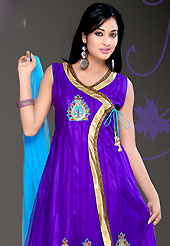 Attract all attentions with this embroidered suit. The dazzling violet net readymade churidar suit have amazing embroidery patch work is done with zari, stone and lace work in form of floral motifs. Color combination of this suit is fascinating and makes you fashionable look. Contrasting sky blue butter crepe churidar and net dupatta is available with this suit. Slight Color variations are possible due to differing screen and photograph resolutions.
