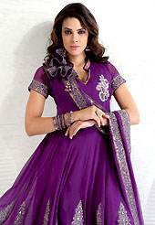 Be the cynosure of all eyes with this wonderful  wear in flattering colors and combinations. This purple chiffon kameez has beautiful embroidered and patch work. Embroidery is done with resham, zari and stone work in form of floral motifs. Embroidery on kameez and dupatta is highlighting the beauty of this suit. Matching santoon churidar and chiffon dupatta is available with this suit. This semi stitch kameez can be customized upto 42 inches. Slight color variations are possible due to differing screen and photograph resolutions.