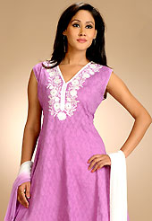 Take the fashion industry by storm in this beautiful embroidered suit. The dazzling light violet cotton readymade churidar suit have amazing embroidery patch work is done with resham and lace work. The entire ensemble makes an excellent wear. Contrasting white cotton churidar and double dye chiffon dupatta is available with this suit. Slight Color variations are possible due to differing screen and photograph resolutions.