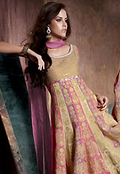 Outfit is a novel ways of getting yourself noticed. The dazzling fawn and light pink chiffon anarkali readymade churidar suit have amazing embroidery patch work is done with resham work. The entire ensemble makes an excellent wear. Contrasting dark mauve churidar and dupatta is available with this suit. Slight Color variations are possible due to differing screen and photograph resolutions.