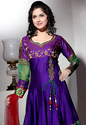 Outfit is a novel ways of getting yourself noticed. The dazzling dark violet and green dupion silk churidar suit have amazing embroidery patch work is done with resham, zari and stone work. The entire ensemble makes an excellent wear. Contrasting maroon churidar and net dupatta is available with this suit. Slight Color variations are possible due to differing screen and photograph resolutions.