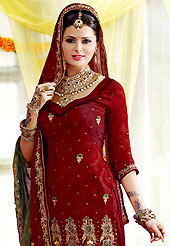 Take the fashion industry by storm in this beautiful embroidered suit. The dazzling maroon salwar kameez have amazing embroidery patch work is done with  zari, sequins and stone work. The entire ensemble makes an excellent wear. Matching salwar and dupatta is available with this suit. Slight Color variations are possible due to differing screen and photograph resolutions.