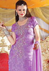 Ultimate collection of embroidered suits with fabulous style. The dazzling mauve salwar kameez have amazing embroidery patch work is done with sequins, zardosi and stone work. The entire ensemble makes an excellent wear. Matching salwar and dupatta is available with this suit. Slight Color variations are possible due to differing screen and photograph resolutions.