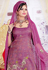 The traditional patterns used on this suit maintain the ethnic look. The dazzling dark onion pink salwar kameez have amazing embroidery patch work is done with zari, sequins, zardosi and stone work. The entire ensemble makes an excellent wear. Matching salwar and dupatta is available with this suit. Slight Color variations are possible due to differing screen and photograph resolutions.