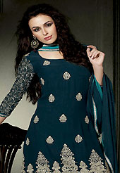 The glamorous silhouette to meet your most dire fashion needs. The dazzling dark teal blue georgette churidar suit have amazing embroidery patch work is done with resham work. Embroidery work on kameez is stunning. This is perfect party wear suit. The entire ensemble makes an excellent wear. Matching churidar and double dye dupatta is available with this suit. Slight Color variations are possible due to differing screen and photograph resolutions.