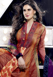 Keep the interest with this designer embroidery suit. The dazzling rust, brown and green net anarkali churidar suit have amazing embroidery patch work is done with self weaving zari, brooch and lace work. Embroidery work on kameez is stunning. This is perfect party wear suit. The entire ensemble makes an excellent wear. Contrasting purple churidar and dupatta is available with this suit. Slight Color variations are possible due to differing screen and photograph resolutions.