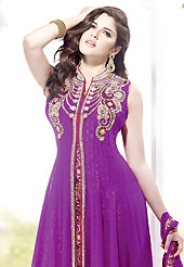 Attract all attentions with this embroidered suit. The dazzling purple georgette readymade churidar suit have amazing embroidery patch work is done with stone work. The entire ensemble makes an excellent wear. Matching santoon churidar and chiffon dupatta is available with this suit. Slight Color variations are possible due to differing screen and photograph resolutions.