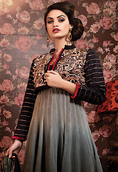 Breathtaking collection of suits with stylish embroidery work and fabulous style. The dazzling shaded grey and black chiffon churidar suit have amazing embroidery patch work is done with resham, zari, stone and lace work. Beautiful embroidery work on kameez is stunning. The entire ensemble makes an excellent wear. Contrasting red santoon churidar and black chiffon dupatta is available with this suit. Slight Color variations are possible due to differing screen and photograph resolutions.