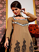An occasion wear perfect is ready to rock you. The dazzling fawn georgette churidar suit have amazing embroidery patch work is done with resham and zari work. Beautiful embroidery work on kameez is stunning. The entire ensemble makes an excellent wear. Contrasting black santoon churidar and chiffon dupatta is available with this suit. Slight Color variations are possible due to differing screen and photograph resolutions.