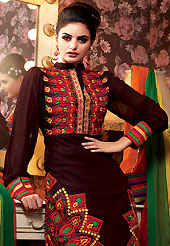 Take the fashion industry by storm in this beautiful embroidered suit. The dazzling dark brown crepe churidar suit have amazing embroidery patch work is done with resham and stone work. Beautiful embroidery work on kameez is stunning. The entire ensemble makes an excellent wear. Matching santoon churidar and green, yellow and red chiffon dupatta is available with this suit. Slight Color variations are possible due to differing screen and photograph resolutions.