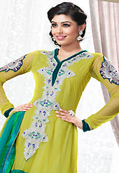 Style and trend will be at the peak of your beauty when you adorn this suit. The dazzling light olive green and turquoise churidar suit have amazing embroidery patch work is done with resham and stone work. Beautiful embroidery work on kameez is stunning. The entire ensemble makes an excellent wear. Contrasting white and olive green churidar and turquoise dupatta is available with this suit. Slight Color variations are possible due to differing screen and photograph resolutions.