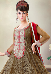 Take a look on the changing fashion of the season. The dazzling dark olive green net churidar suit have amazing embroidery patch work is done with resham, zari and stone work. Beautiful embroidery work on kameez is stunning. Matching santoon churidar and contrasting red chiffon dupatta is available with this suit. Slight Color variations are possible due to differing screen and photograph resolutions.