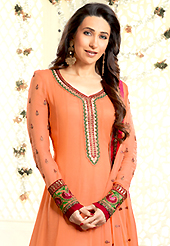 Dreamy variation on shape and forms compliment your style with tradition. The dazzling dark peach georgette churidar suit have amazing embroidery patch work is done with resham, zari and lace work. Beautiful embroidery work on kameez is stunning. Contrasting maroon churidar and matching dark peach dupatta is available with this suit. Slight Color variations are possible due to differing screen and photograph resolutions.
