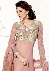 Breathtaking collection of suits with stylish embroidery work and fabulous style. The dazzling peach faux georgette churidar suit have amazing embroidery patch work is done with resham, zari, sequins, stone and lace work. Beautiful embroidery work on kameez is stunning. The entire ensemble makes an excellent wear. Contrasting cream santoon churidar and matching chiffon dupatta is available with this suit. Slight Color variations are possible due to differing screen and photograph resolutions.