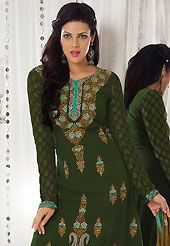 The color range from natural shades looks ravishing. The dazzling dark olive green faux georgette churidar suit have amazing embroidery patch work is done with resham and zari work. Beautiful embroidery work on kameez is stunning. The entire ensemble makes an excellent wear. Matching santoon churidar and light brown chiffon dupatta is available with this suit. Slight Color variations are possible due to differing screen and photograph resolutions.