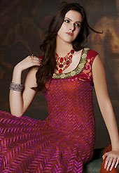 The popularity of this dress comes from the fact that it showcases the beauty modesty as well as exquisitely. The dazzling dark rust and magenta net readymade churidar suit have amazing embroidery patch work is done with resham, zari, stone and beads work. The entire ensemble makes an excellent wear. Matching dark magenta santoon churidar and rust net dupatta is available with this suit. Slight Color variations are possible due to differing screen and photograph resolutions.
