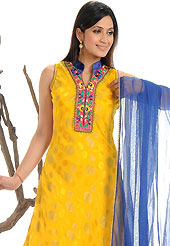 Get ready to sizzle all around you by sparkling suit. The dazzling yellow dupion silk readymade churidar suit have amazing embroidery patch work is done with resham, zari, sequins, stone and lace work. The entire ensemble makes an excellent wear. Contrasting blue dupion silk churidar and net dupatta is available with this suit. Slight Color variations are possible due to differing screen and photograph resolutions.