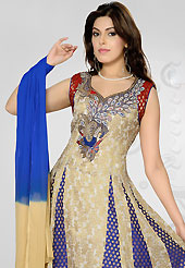 The glamorous silhouette to meet your most dire fashion needs. The dazzling beige, off white and blue readymade chanderi silk churidar suit have amazing embroidery patch work is done with self weaving zari, stone and beads work. The entire ensemble makes an excellent wear. Matching blue dupion silk churidar and double dye chiffon dupatta is available with this suit. Slight Color variations are possible due to differing screen and photograph resolutions.