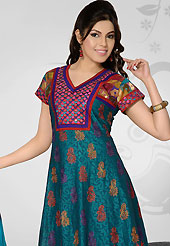 Take the fashion industry by storm in this beautiful embroidered suit. The dazzling teal blue cotton readymade churidar suit have amazing embroidery patch work is done with resham and mirror work. The entire ensemble makes an excellent wear. Contrasting dark red dupion silk churidar and shaded dupatta is available with this suit. Slight Color variations are possible due to differing screen and photograph resolutions.
