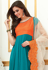 Make an adorable statement in this smashy dark orange and teal blue faux georgette readymade salwar kameez. Color combination of suit is fascinating and make you trendy look. This casual wear drape made with cotton fabric. Matching teal blue churidar and off white embroidered work dupatta is available with this suit. Slight Color variations are possible due to differing screen and photograph resolutions.
