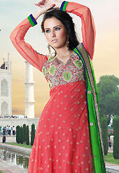 The most beautiful refinements for style and tradition. The dazzling dark peach net churidar suit have amazing embroidery patch work is done with resham, zari, sequins, stone and beads work. Beautiful embroidery work on kameez is stunning. The entire ensemble makes an excellent wear. Matching santoon churidar and green chiffon dupatta is available with this suit. Slight Color variations are possible due to differing screen and photograph resolutions.