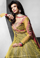 An occasion wear perfect is ready to rock you. The dazzling light olive green and dark grey net readymade anarkali churidar suit have amazing embroidery patch work is done with resham, stone, beads and lace work. Beautiful embroidery work on kameez is stunning. The entire ensemble makes an excellent wear. Matching churidar and dupatta is available with this suit. Slight Color variations are possible due to differing screen and photograph resolutions.