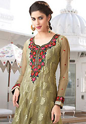 Your search for elegant look ends here with this lovely suit. The dazzling light olive green churidar suit have amazing embroidery patch work is done with resham, zari and stone work. Beautiful embroidery work on kameez is stunning. The entire ensemble makes an excellent wear. Matching santoon churidar and chiffon dupatta is available with this suit. Slight Color variations are possible due to differing screen and photograph resolutions.