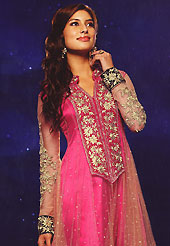 Your search for elegant look ends here with this lovely suit. The dazzling peach and pink net anarkali churidar suit have amazing embroidery patch work is done with resham, zari and sequins work. Beautiful embroidery work on kameez is stunning. The entire ensemble makes an excellent wear. Matching pink santoon churidar and faux chiffon dupatta is available with this suit. Slight Color variations are possible due to differing screen and photograph resolutions.
