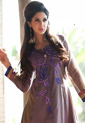 This season dazzle and shine in pure colors. The dazzling dusty brown chanderi silk readymade churidar suit have amazing embroidery patch work is done with resham work. Beautiful embroidery work on kameez is stunning. The entire ensemble makes an excellent wear. Contrasting purple churidar and shaded dupatta is available with this suit. Slight Color variations are possible due to differing screen and photograph resolutions.
